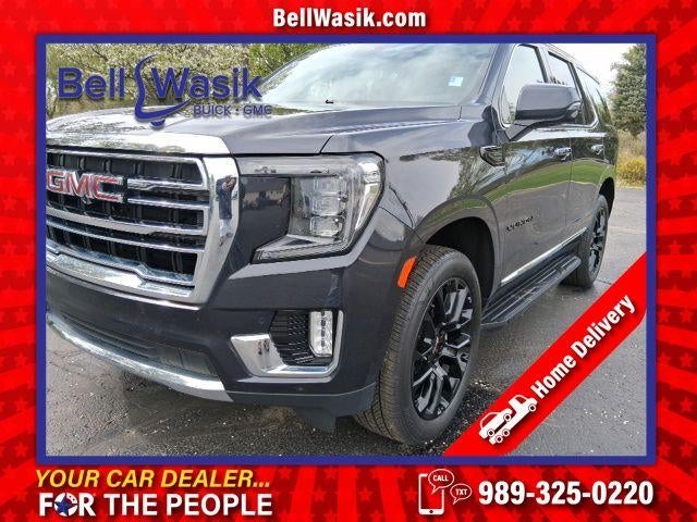 2024 GMC Yukon SLT in Titanium Rush Metallic — front three-quarter view