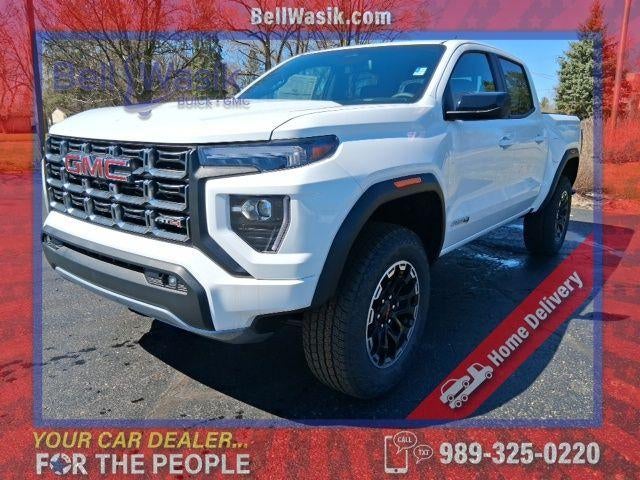 2026 GMC Canyon AT4 in Summit White — front three-quarter view