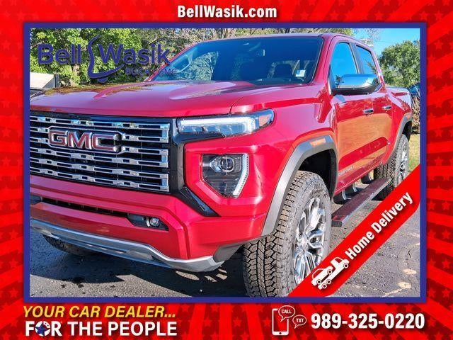 2026 GMC Canyon Denali in Volcanic Red Tintcoat — front three-quarter view